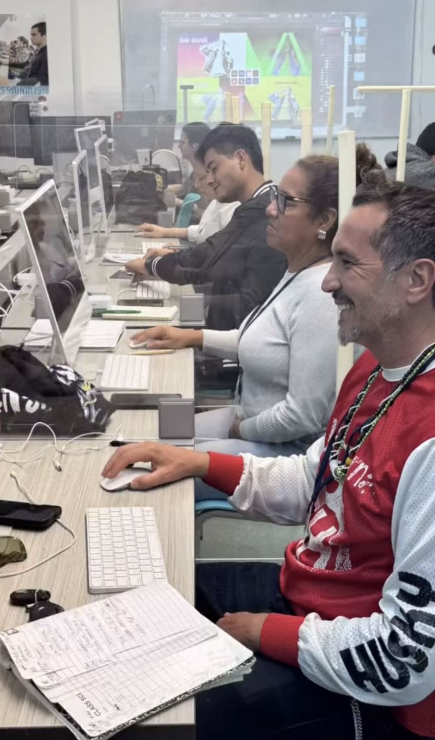 Students learning digital design at The English Center
